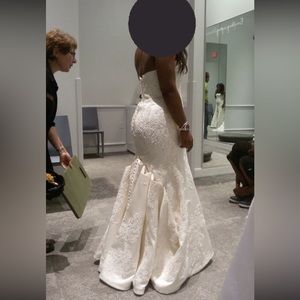 Wedding dress and veil for sale. Cleaned & stored. Comes in the storage box.